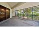 The screened-in patio provides a comfortable outdoor space for relaxation and entertainment at 11735 Rolling Pine Ln, Port Richey, FL 34668