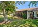 Cozy screened porch provides a relaxing outdoor space with a view of the lush backyard and mature trees at 11735 Rolling Pine Ln, Port Richey, FL 34668