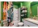 Bright bathroom features a shower-tub combination, modern vanity, and floral shower curtain at 12201 Labrador Duck Labrador Duck Rd, Weeki Wachee, FL 34614