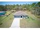 Aerial shot showcasing the home's well-manicured lawn and charming curb appeal at 12201 Labrador Duck Labrador Duck Rd, Weeki Wachee, FL 34614