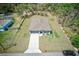 Aerial front view of the beautiful single Gathering home with well-maintained landscaping at 12201 Labrador Duck Labrador Duck Rd, Weeki Wachee, FL 34614