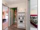 Hallway with views to a bedroom and a bathroom; features stylish decor and shelving at 12201 Labrador Duck Labrador Duck Rd, Weeki Wachee, FL 34614