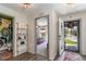 Hallway view with a bedroom and a bathroom; stylish decor, colorful rugs and shelving at 12201 Labrador Duck Labrador Duck Rd, Weeki Wachee, FL 34614