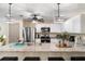 Spacious kitchen featuring granite countertops, a breakfast bar, and pendant lighting at 12201 Labrador Duck Labrador Duck Rd, Weeki Wachee, FL 34614