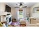 Cozy living room with fireplace, white couch, and plenty of natural light at 12201 Labrador Duck Labrador Duck Rd, Weeki Wachee, FL 34614