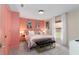 Bright main bedroom features a plush bed, stylish art, and ample natural light at 12201 Labrador Duck Labrador Duck Rd, Weeki Wachee, FL 34614