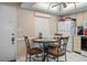 Cozy eat-in kitchen features a round table with seating for four, and convenient access to appliances at 12505 Dearborn Dr # C, Hudson, FL 34667