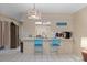 Kitchen featuring a breakfast bar with seating and tiled floors at 12505 Dearborn Dr # C, Hudson, FL 34667