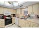 Bright kitchen features ample cabinet space, modern appliances, and easy access to the living area at 12505 Dearborn Dr # C, Hudson, FL 34667