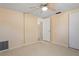 Bedroom with neutral carpet, a ceiling fan, and closet at 12613 Social Dr, Hudson, FL 34667