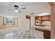 Well-lit kitchen featuring classic wood cabinetry, white appliances, and a functional layout at 12613 Social Dr, Hudson, FL 34667