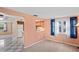Open-concept living area that seamlessly connects to the adjacent kitchen and dining spaces at 12613 Social Dr, Hudson, FL 34667