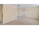 Living room with neutral carpet and tile floor entryway at 12613 Social Dr, Hudson, FL 34667
