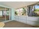 Screened porch with sliding glass doors and outdoor views at 12613 Social Dr, Hudson, FL 34667
