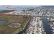 An aerial view of a waterfront neighborhood with canals leading to the Gulf of Mexico at 12801 5Th Isle, Hudson, FL 34667