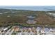 Community with waterfront homes and the Gulf of Mexico in the background at 12801 5Th Isle, Hudson, FL 34667