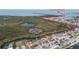Stunning aerial view of waterfront homes, canals, and the Gulf of Mexico in a desirable coastal community at 12801 5Th Isle, Hudson, FL 34667