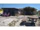 This backyard features a patio, a screened-in porch, and an outdoor dining area with a unique tiled table at 12801 5Th Isle, Hudson, FL 34667