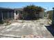 Enjoy outdoor living in this backyard featuring a patio with a pergola covered in flowers, ideal for relaxation at 12801 5Th Isle, Hudson, FL 34667
