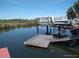 Dock with boat lift on the canal, perfect for watercraft enthusiasts with easy water access at 12801 5Th Isle, Hudson, FL 34667