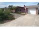 Charming one-story brick home with an attached garage and a well-maintained front yard at 12801 5Th Isle, Hudson, FL 34667