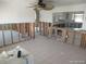 Open concept kitchen with tile flooring and island that needs some love at 12801 5Th Isle, Hudson, FL 34667