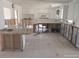 Kitchen ready for a remodel with bar seating, tile, and white cabinets at 12801 5Th Isle, Hudson, FL 34667