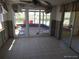 Sunroom with sliding glass doors, tile flooring and lots of light at 12801 5Th Isle, Hudson, FL 34667