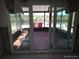 Sunroom with sliding glass doors, tile flooring, and water views at 12801 5Th Isle, Hudson, FL 34667