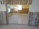 Sunroom with sliding glass doors, tile flooring that needs updating at 12801 5Th Isle, Hudson, FL 34667