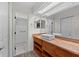 Updated bathroom featuring a wood vanity, vessel sink, and modern finishes at 152 Chelsea Ct, Dunedin, FL 34698