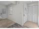 Open foyer with tile flooring, front door, closet, and natural light at 152 Chelsea Ct, Dunedin, FL 34698