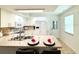 Bright kitchen featuring white cabinets, a modern countertop, and stainless steel appliances at 152 Chelsea Ct, Dunedin, FL 34698