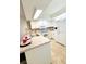 A modern kitchen featuring updated appliances and countertops at 152 Chelsea Ct, Dunedin, FL 34698