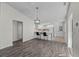 Open-concept living room featuring hardwood floors, leading into the kitchen at 152 Chelsea Ct, Dunedin, FL 34698