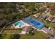 Resort-style pool and tennis court surrounded by lush landscaping at 152 Chelsea Ct, Dunedin, FL 34698