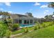 Enjoy a private backyard oasis with a screened pool and manicured lawn, perfect for entertaining at 2309 Terrace View Ln, Spring Hill, FL 34606