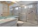 Bright bathroom featuring a tub shower combination and grab bars at 2309 Terrace View Ln, Spring Hill, FL 34606