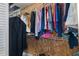 Walk-in closet offering ample storage space with multiple shelves and hanging rods at 2309 Terrace View Ln, Spring Hill, FL 34606