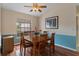 Cozy dining area with natural light, perfect for Gathering meals and entertaining guests at 2309 Terrace View Ln, Spring Hill, FL 34606