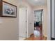 Hallway with hardwood floors and doorways leading to various rooms of the house at 2309 Terrace View Ln, Spring Hill, FL 34606