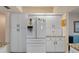 A bright kitchen is shown with modern appliances and white cabinets for ample storage at 2309 Terrace View Ln, Spring Hill, FL 34606