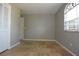 Bedroom featuring travertine floors, a window, and a closet at 23310 Cascade Pl, Land O Lakes, FL 34639