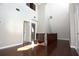 Large bonus room with natural light and hardwood floors, providing a warm and inviting atmosphere at 23310 Cascade Pl, Land O Lakes, FL 34639