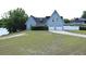 Charming two-story home with a two-car garage, manicured lawn, and mature trees at 23310 Cascade Pl, Land O Lakes, FL 34639