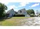 Home with manicured lawn, mature trees, and a two-car garage, showcasing curb appeal at 23310 Cascade Pl, Land O Lakes, FL 34639