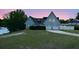 Charming home featuring a neatly manicured lawn, symmetrical roof lines, and attached two car garage at 23310 Cascade Pl, Land O Lakes, FL 34639