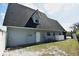 Home exterior with a backyard that provides access to a lake at 23310 Cascade Pl, Land O Lakes, FL 34639