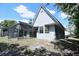 Home exterior showcasing a screened-in porch, set on a spacious lot with mature trees and sunny skies at 23310 Cascade Pl, Land O Lakes, FL 34639
