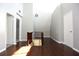 Bright hallway with hardwood floors, staircase, and neutral paint at 23310 Cascade Pl, Land O Lakes, FL 34639